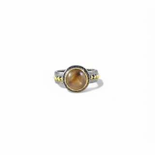 Handmade oxidised silver ring with brown rutilated quartz and gold bezel.